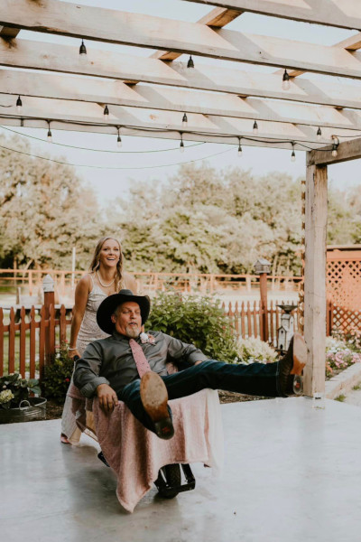 Having fun at Civil War Ranch - Bride pushes Groom in wheelbarrow